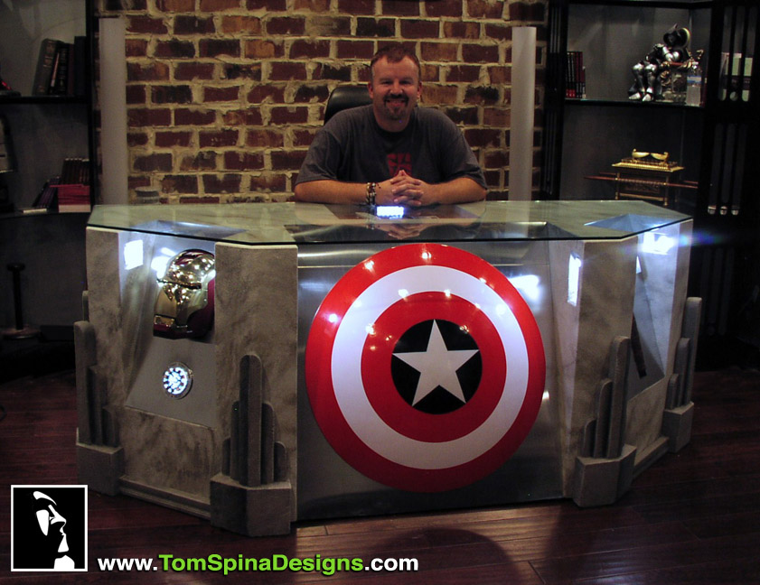 Happy Client behind The Avengers Desk